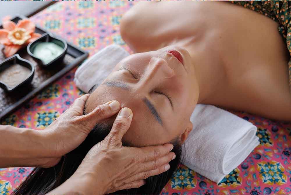 image 3 of womain having a massage at Anavana Beach Resort Spa in Koh Samui, Thailand