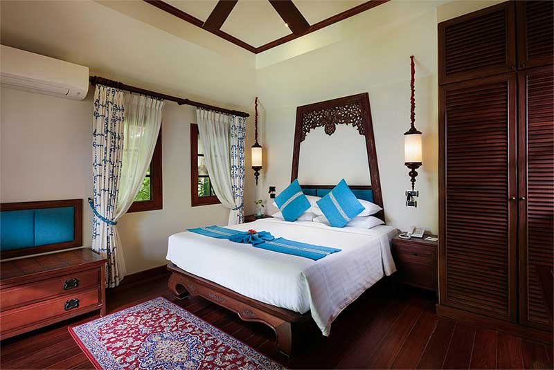 interior of cottage with blue decor at Anavana Beach Resort