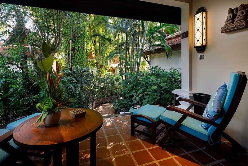 sofa angle image of cottage with blue decor at Anavana Beach Resort