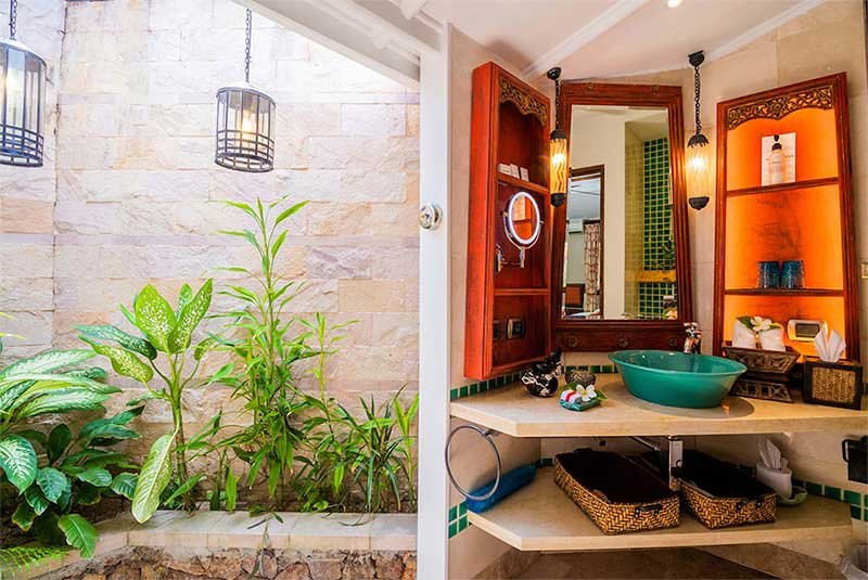 view inside the bathroom of cottage with orange decor at Anavana Beach Resort